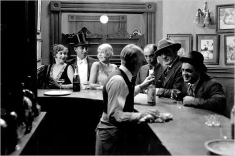 Source: Photograph, speakeasy In 1920 Prohibition (the ban of the sale, production, or consumption of alcohol) was enacted in most Canadian provinces. As a result, private clubs called speakeasies became popular places to socialize, smoke, and illegally drink. Bugsy Malone, 1920s Aesthetic, Prohibition Party, 1920s Speakeasy, Speakeasy Party, Speakeasy Bar, 1920s Party, Cat Pajamas, Easy Parties