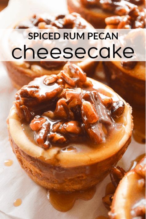 Spiced Rum Cheesecakes are little 4-bite treats laced with spiced rum and smothered in a homemade boozy caramel studded with pecans. This dessert is perfect for dinner parties, holidays, and for all the spiced rum lovers in your life. Alcoholic Cheesecake, Rum Cheesecake Recipe, Infused Snacks, Spiced Rum Recipes, Rum Desserts, Drunken Desserts, Pecan Cheesecake Recipes, Boozy Baking, Alcoholic Treats