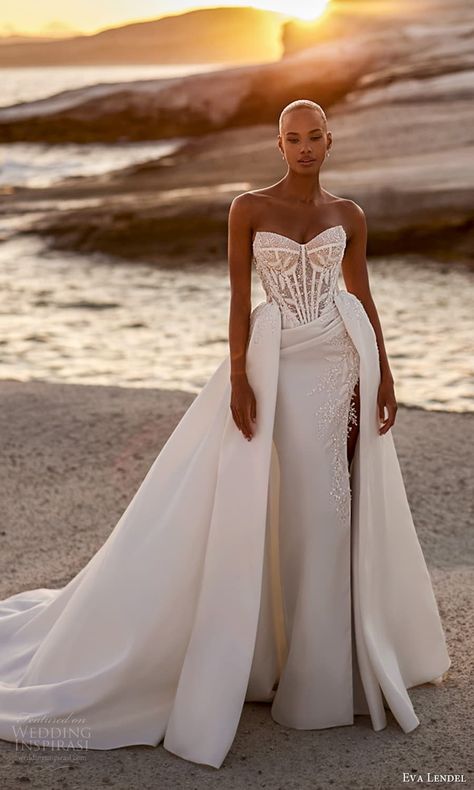 eva lendel fall 2025 bridal strapless cat eye neckline embellished corset bodice clean sheath wedding dress a line overskirt chapel train (9) mv -- Eva Lendel 2025 Wedding Dresses | Wedding Inspirasi  #wedding #weddings #bridal #weddingdress #weddingdresses #bride #fashion #collection:Venus #label:EvaLendel #season:Fall/Winter #week:492024 #year:2025 ~ Nigerian Weddings Dress, Summer Wedding Dress For Bride, Wedding Dress 2025, Wedding Dress With Overskirt, Convertible Wedding Dress, Convertible Wedding Dresses, Embellished Corset, Amy White, Eva Lendel