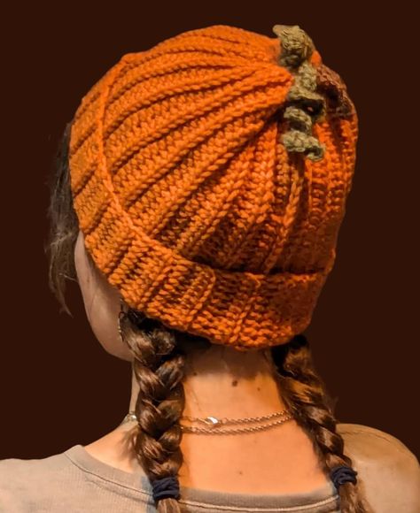 Handmade Crochet Pumpkin beanie! Made from soft orange 100% acrylic yarn, with brown stem and green leaf and vine on top. Warm and Cozy, one size fits most (Model hat size is 23"), no lining but thick material. Crochet Fall Beanie, Orange Crochet Projects, Crochet Pumpkin Beanie, Pumpkin Beanie, Pumpkin Hat Crochet, Crochet Fruit Beanie, Pumpkin Crochet Hat, Beanie Knitting, Crocheted Beanies