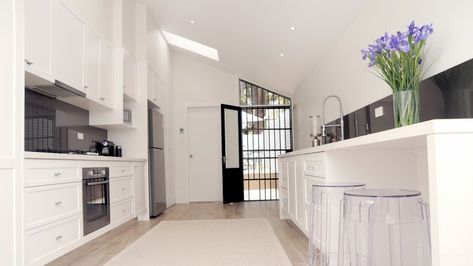 In this kitchen Dulux Whisper White was chosen to add warmth to this house, which does not receive much natural light. Dulux Vivid White, Dulux Whisper White, White Kitchen Wall Tiles, Perfect White Paint, Cork Decor, Dulux Natural White, Dulux White, Dulux Paint Colours, White Wooden Floor