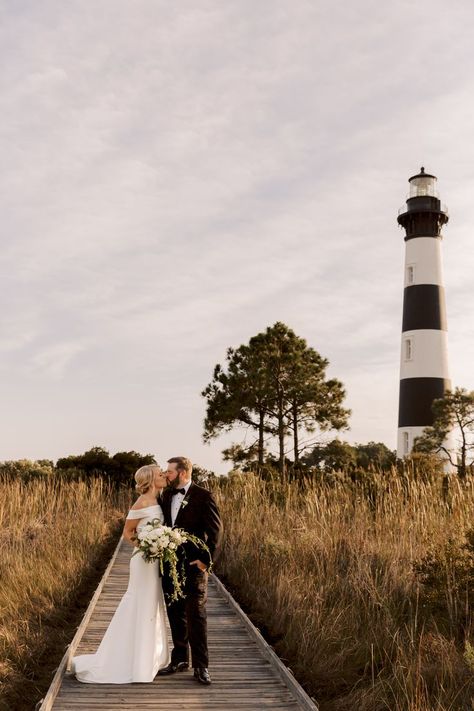 head over to the blog to see more of this intimate wedding at bodie island lighthouse. Bodie Island Lighthouse, Obx Wedding, Lighthouse Wedding, Whimsical Wedding Decorations, Outer Banks Wedding, Surprise Engagement, Nags Head, Intimate Wedding Ceremony, Waterfront Wedding