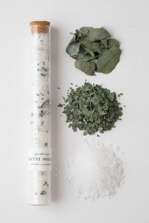 Transform your bath into a refreshing ocean retreat with our Sea Salt + Eucalyptus Bath Soak Tube. Let the crisp scent of sea salt mingle with the invigorating aroma of eucalyptus as you immerse yourself in a tranquil, spa-like experience. This luxurious soak is designed to cleanse the mind, rejuvenate the body, and elevate your bathing ritual to a new level of relaxation. Encased in an elegant glass test tube with a natural cork closure, this bath soak is a testament to self-care with a touch o Bath Salt Test Tube, Soap Room Ideas, Eucalyptus Bath Salts, Bath Salts Aesthetic, Bath Salt Photography, Wellness Product Photography, Bath Salts Display, Bath Salts Packaging Ideas, Salt Bath Recipe