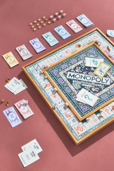 A Fun Game: Anthropologie Monopoly Anthropologie Monopoly, Aesthetic Board Games, Club Photoshoot, Monopoly Board Game, Vintage Bookshelf, Housing Ideas, Monopoly Board, Monopoly Game, Board Game Design