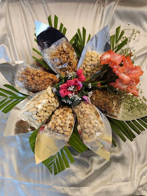 Witness the artistry of nature and taste combined in our captivating Dry Fruit Flower Gift Tray, where meticulously packed dry fruit packets form a stunning bloom, elegantly adorned with lush greens. Mapp Academy students have created this exquisite masterpiece, weaving healthful indulgence with natural beauty. The flower-shaped arrangement, crafted from diverse dry fruit packets, presents a unique visual delight.#DryFruitFlowerTray #NutritiousIndulgence #MappAcademyCraftsmanship Dry Fruits Packing Ideas Gift In Jars, Dry Fruit Tray Decoration Ideas, Dry Fruit Packing Ideas, Dry Fruits Packing Ideas Gift In Tray, Dryfruits Packing Ideas, Dry Fruits Packing Ideas, Dry Fruits Packing Ideas Gift, Dry Fruit Hamper, Dry Fruits Packing