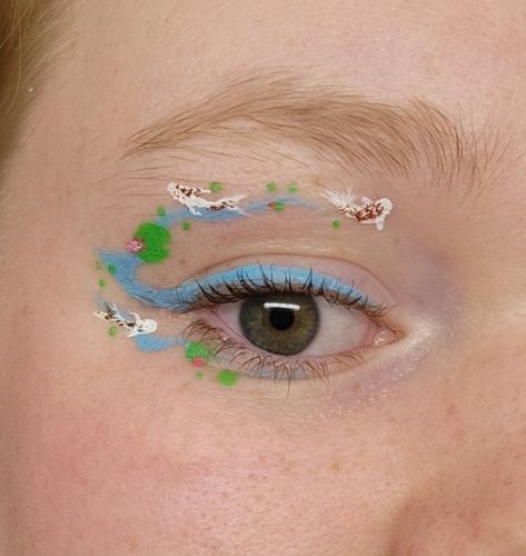 Fish Eyeliner Eye Makeup, Fish Eyeliner, Koi Fish Makeup, Fish Eye Makeup, Blue Graphic Eyeliner, Fish Inspired Makeup, Water Activated Eyeliner Looks, Abstract Eyeliner, Blue Graphic Liner