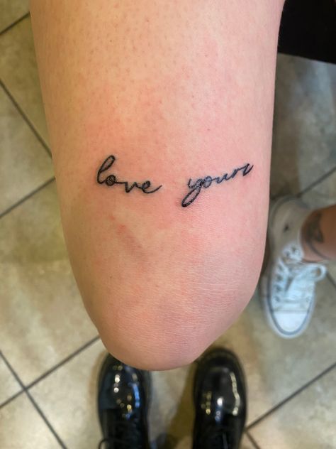 Love Yourz J Cole Tattoo Leg, Above Knee Cursive Tattoo, Love Yourz J Cole Cursive, Love Yours In Cursive Tattoo, Protect Your Peace Tattoo Cursive, Words Above Knee Tattoos Women, Love Yourz Tats, Love Yourz J Cole Tattoo Cursive, Love Yours J Cole Tattoo