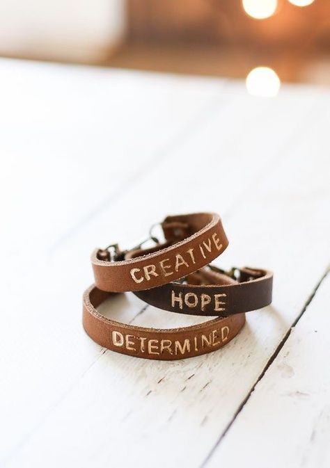 Easily make this personalized DIY leather word bracelet! It makes the perfect DIY gift idea! | Pretty Handy Girl | DIY jewlery | #prettyhandygirl #DIYjewelry #craft Diy Personalized Bracelets, Easy Leather Bracelet Diy, Cricut Leather Bracelet, Leather Stamping Diy, How To Stamp Leather Diy, Cricut Bracelet Ideas, Leather Bracelet Cricut, Diy Leather Bracelet Tutorial, Cricut Bracelet