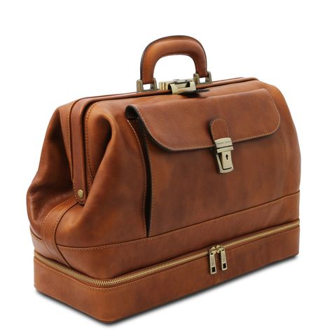 Handcrafted in Italy, this doctor bag features a roomy interior and an exterior bottom zippered compartment for quick access to essentials. Made with Italian vegetable-tanned, hand-stained, full grain calfskin leather. Features one main compartments, zippered bottom exterior compartment, inside large opened pocket, inside zip pocket, front pocket with closure, credit card pockets, pen holder, leather handle, metal push lock clasp closure with key, nickel and antique brass hardware, rigid structu Doctors Bag, Wool Accessories, Italian Leather Bags, Mens Travel, Daily Bag, Casual Leather Shoes, Mens Travel Bag, Leather Travel Bag, Doctor Bag