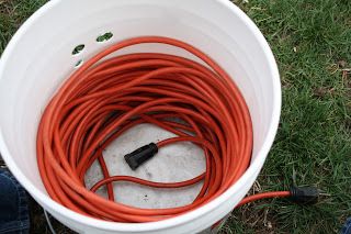 The Redeemed Gardener: "Cord in a Bucket" How to Store Extension Cords Store Extension Cords, Garage Hacks, Garage Organizing, Carport Ideas, Bucket Ideas, Garage Tool Organization, Garage Organization Diy, Extension Cords, Cord Storage