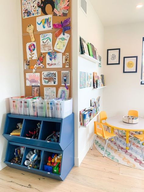 Playroom With No Windows, Living Room Classroom Combo, Art Space Kids Room, Playroom Design Basement, Creating A Room Divider Small Spaces, Yellow Living Room Accent Wall, Playroom Tote Storage, School Aged Playroom, Playroom Classroom Combo