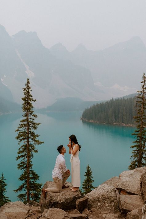 She said yes! Romantic proposal in Banff at Moraine Lake with a beautiful blue lake and mountains as the backdrop, in the Canadian Rockies. They had their dog be a part of the proposal too - engagement and proposal photos by Havilah Heger Wedding Proposal Ideas Engagement, Surprise Proposal Pictures, Lac Moraine, Cute Proposal Ideas, Love Your Partner, Unique Proposals, Proposal Pictures, Creating Keepsakes, Couple Engagement Pictures