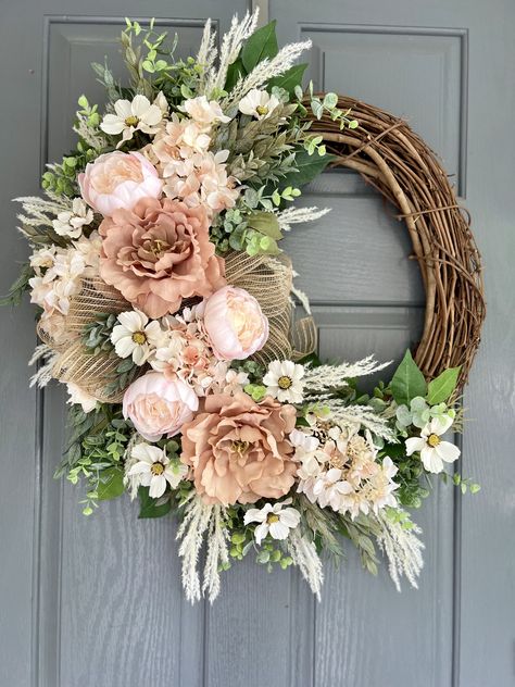 This vibrant wreath will be a show stopper in any room or door in your home!  Description: measuring approximately 22 inches in diameter this wreath begins on a grapevine wreath. Layers of faux greenery, faux cream hydrangeas and peonies, faux,  pampas grass and faux fillers. Whether on a front door or in your home on a mantle or mirror, this wreath will add warmth, and a unique touch to your home. This wreath is custom created. No two are alike, but always created with the same amount of materi Trendy Wreaths Front Doors, Fall Wreath For Front Door, Spring Wreaths For Front Door, Floral Wreaths, Bridal Shower Wreaths, Mesh Ribbon Wreaths, Decorated Wreaths, Floral Door Wreaths, Summer Door Wreaths