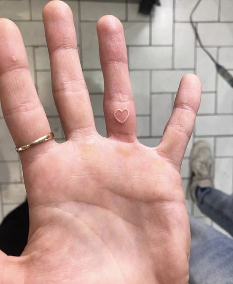 a tat done by insta @european.son.420 Heart Tiny Tattoo, White Heart Tattoo, White Heart Tattoos, Tattoo On Finger, Heart Tattoo On Finger, Stick N Poke Tattoo, Tiny Tattoo, Poke Tattoo, Stick And Poke