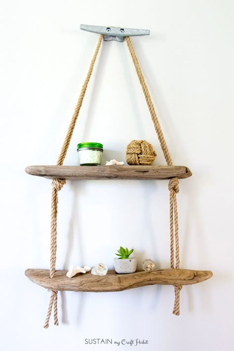 Learn how easy it is to make a DIY hanging rope shelf. It's the perfect nautical wall decor idea for the lake house or cottage! Diy Rope Design, Driftwood Shelves, Hanging Rope Shelves, Rustic Coastal Decor, Diy Nautical Decor, Diy Driftwood, Deco Marine, Driftwood Diy, Painted Driftwood