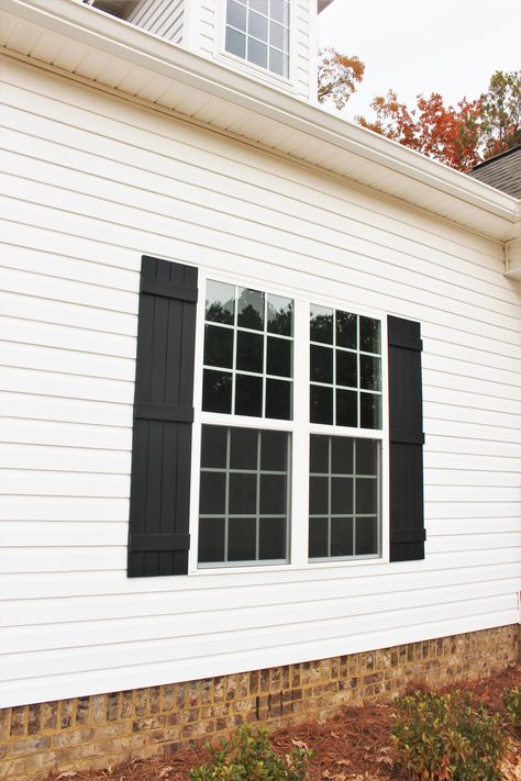 White Cottage Black Shutters, Black Board And Batten Shutters, Black Farmhouse Shutters Exterior, White Windows With Black Shutters, Shutters Exterior Black, Diy Black Shutters, Black House White Shutters, Modern Black Shutters, White House Black Shutters Farmhouse