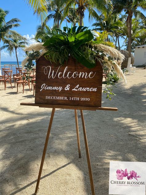 CBS166 welcome sign at Blue venado tropical foliage and pampas grass #welcomesign #weddingsigns #tropicaldecor #bluevenado Beach Arrangements, Foliage Wedding Decor, Hawaii Flowers, Gift Favors, Tropical Beach Wedding, Welcome Table, Welcome Board, Foliage Wedding, Caribbean Wedding