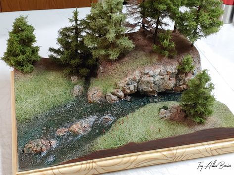 Diorama I made using about 80% leather and hairs like boar hair. Most of the shorter grass/needles are synthetic. I created real time lightning bugs by running fiber optics into the scene (check out the video at the end of the album to see them in action). I embedded two tiny leather fish about the size of a drop of water into the river epoxy (small mouth bass, and a northern pike). The diorama is about 23" by 18". I have a lot more pictures and explanation of the process in an album on my faceb Diorama Ideas Forest, Camping Diorama, Wetland Habitat Diorama, Lake Diorama Project, River Diorama, Water Diorama, Diarama Ideas Water, Lake Diorama, Forest Diorama