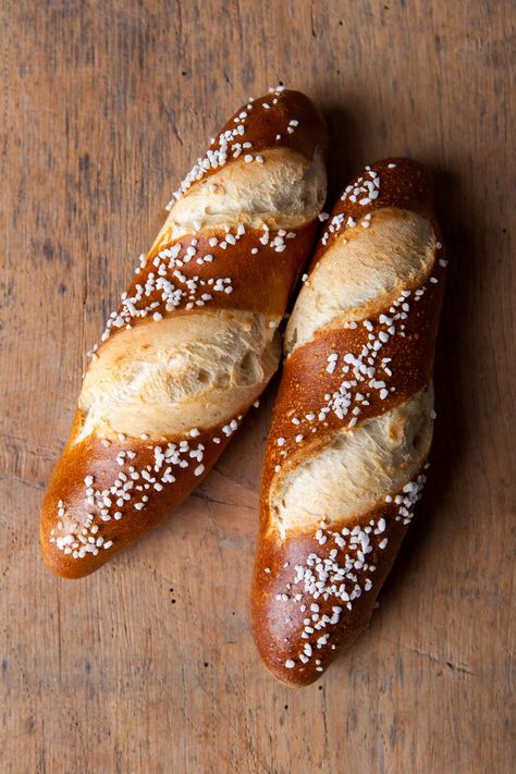 There are many stories of where pretzels and pretzel bread sticks came from. One Swabian story, which supposedly goes back to 1477, tell of a master baker Frieder, who not only invented the pretzel bread stick out of necessity, but that a cat jumped on the baking sheet as he was baking and caused dough Irish Pretzels, Savoury Loaf, Buns And Braids, Tailgate Treats, Bavarian Pretzel, Bread Stick, Pretzel Bread, Pretzel Dough, German Bread