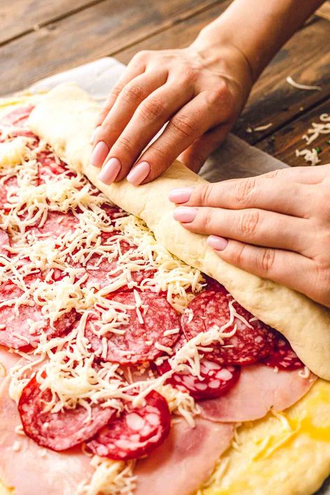 Looking for a quick and easy dinner recipe that is kid friendly? This Stromboli is your answer! Pizza dough rolled up with ham, pepperoni and cheese and then baked. Slice it and dunk it in marinara sauce. It's a recipe the entire family will love and request again and again. Pizza Stromboli, Stromboli Recipe Easy, Homemade Stromboli, Pepperoni And Cheese, Boys Food, Stromboli Recipe, Pizza Roll, Calzone Pizza, Supper Ideas