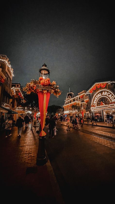 Halloween decor at Disneyland | Main Street, USA Disneyland Halloween Wallpaper, Disney World Halloween Aesthetic, Disney Main Street Aesthetic, Disneyland Halloween Aesthetic, Carsland Disneyland Halloween, Main Street Usa Disney World Aesthetic, Main Street Usa Disney World, Halloween Time At Disneyland, Halloween Street