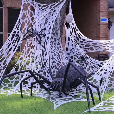 PRICES MAY VARY. Super Large Halloween Spider Web:You will receive a large size unfinished spider webbing without holes and 10 Pcs metal landscape staples. You can cut it into smaller fragments and cut random holes for your preferences to enhance the Halloween atmosphere (Scissors, Spiders and Other Halloween Decorations in the Picture DO NOT INCLUDE) Large Spider Web & Premium Quality: The size of stretchable spider web is 13.5 Ft long x 3.3 Ft wide. The maximum spider webs can be stretched to Spider Web Halloween Decorations, Halloween Web, Orange Spider, Large Spiders, Spider Web Decoration, Halloween Spider Decorations, Indoor Party, Spider Decorations, House Yard