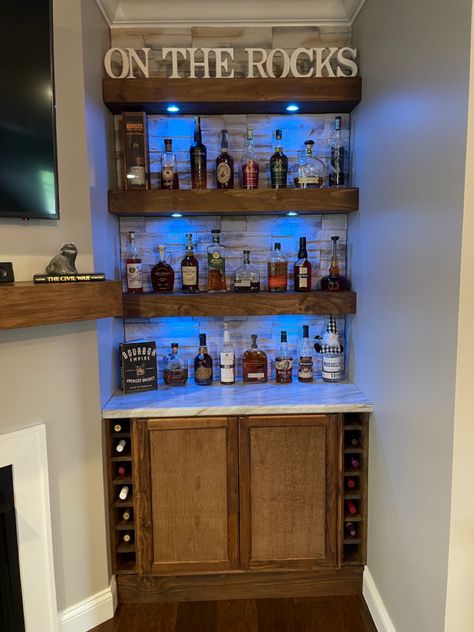 Started with a standard cabinet from Lowes Built the shelves then pick out the stone. Turned out beautiful Kitchen Alcohol Bar Ideas, Home Built In Bar Ideas, Shelves For Liquor Bottles, Diy Closet Bar, Closet To Bar Ideas, Home Inspo On A Budget, Bar Cabinet At Home, Above Bar Shelving, Bar Wall Shelves Ideas