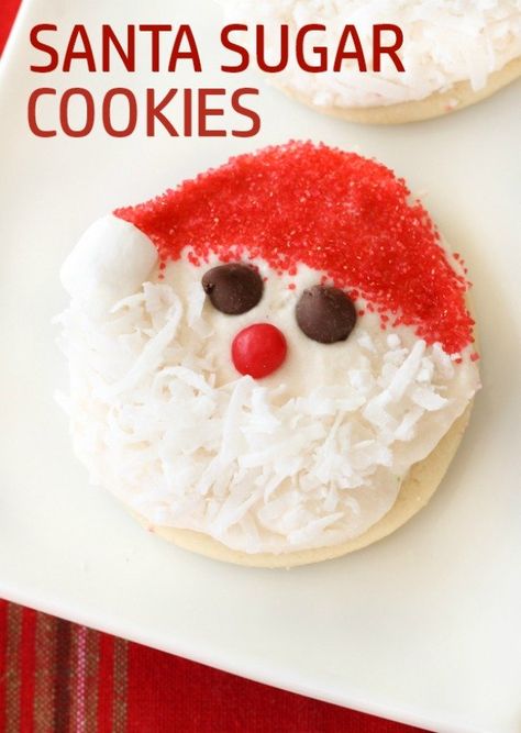 Santa Sugar Cookies | Six Sisters' Stuff These Santa Sugar Cookies are such a fun idea for Christmas. They are our favorite sugar cookie recipe. They have a secret ingredient that makes them moist and soft. You are going to love this recipe, and no fancy cookie cutter is needed! #santa #cookies Santa Cookies Recipes, Santa Claus Cookies Decorated, Santa Sugar Cookies Decorated, Santa Sugar Cookies, Santa Cookie Recipe, Friendsgiving Ideas, Cinnamon Sugar Cookies, Santa Cookie, Six Sisters Stuff