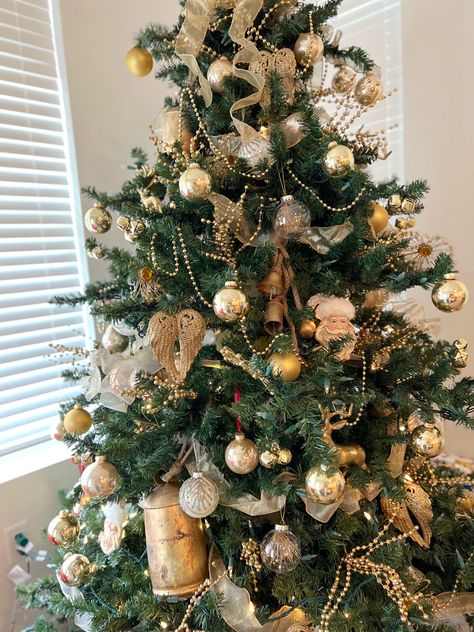 Christmas tree, gold decorations, gold Christmas decorations angel wings on tree bells on tree Christmas tree decorating Christmas Tree Gold Decorations, Bell Christmas Tree, Christmas Tree Gold, Gold Decorations, Christmas Tree Decorating, Bell Christmas, Gold Christmas Decorations, Tree Decorating, Gold Christmas Tree