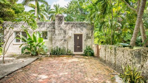 The "Peacock House" in Coconut Grove just sold for $850,000 to a buyer who will preserve the 1,876-square-foot gem booming with character and featuring a fantastic and unique limestone wall across the front of the property. Coconut Grove Miami Houses, Peacock House, Coconut Grove Miami, Limestone Wall, Miami Houses, Coconut Grove, Just Sold, The Peacock, Estate Homes