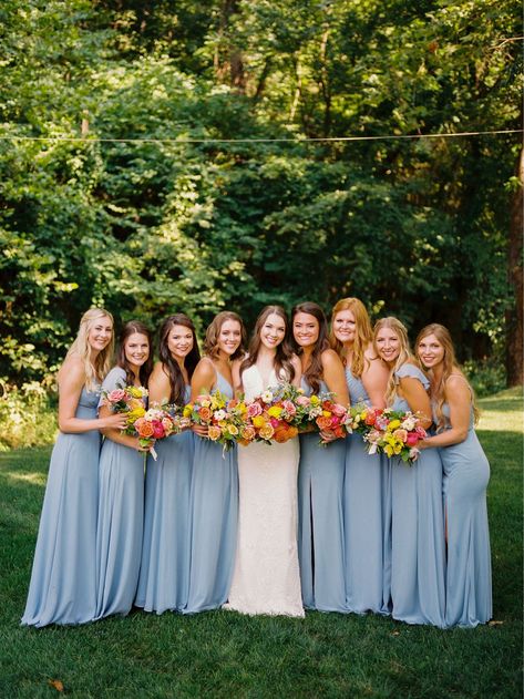 Blue Bridesmaid Dresses Dusty Blue, Wedding Party Blue Suits Color Schemes, Bridesmaid Dresses For Spring Wedding, Dusty Blue Bridesmaid Dresses With Colorful Flowers, Bridesmaids With Wildflower Bouquets, Summer Blue Bridesmaid Dresses, Spring Dusty Blue Wedding, July Wedding Bridesmaid Dresses, Orange Pink Blue Wedding Bridesmaid Dresses