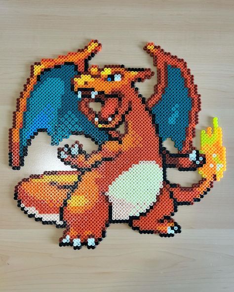 Liara Rodriguez-Castro | SOLD-This Perler Bead Charizard is one of my favorite projects to date! He is going up in my shop at 12:30pm Eastern tomorrow (04/23)at a… | Instagram Perler Bead Charizard, Pokemon Date Ideas, Charizard Perler Beads, Pokémon Perler Beads, Perleplader Ideas, Pokemon Perler Bead Patterns, Bead Pokemon, Perler Bead Pokemon Patterns, Hama Beads Pokemon