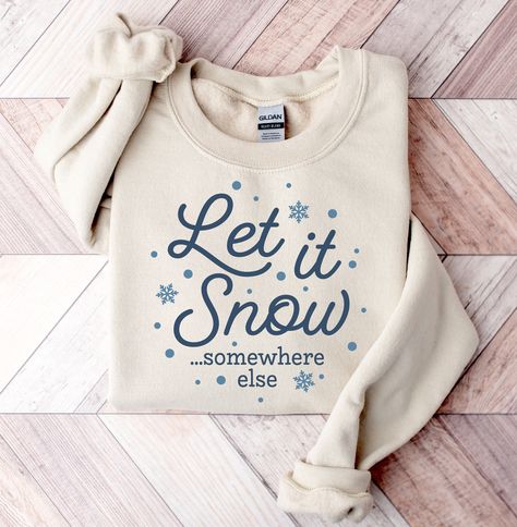 Let it Snow Somewhere Else Sweatshirt Cold Weather Sweater Funny Winter Shirt Always Cold Crewneck Winter Christmas Shirt Funny Snow Pullover * Shipping on Faster End for U.S.* -Unisex crewneck sweatshirt -For oversized look size up 1-2 sizes -Comfy & Cozy -Ink designs -Collar is ribbed knit, so it retains its shape even after washing. -No itchy side seams -50% cotton, 50% polyester -Medium-heavy fabric -Loose fit -Sewn-in label -Runs true to size -Machine Wash Cold Sweater Weather Sweatshirt, Sweater Vinyl Ideas, Winter Graphic Tees, Winter Shirt Designs, Sweater Sayings, Christmas Sweatshirt Outfit, Outfit Ideas Shirt, Christmas Sweatshirt Ideas, Christmas Shirt Ideas