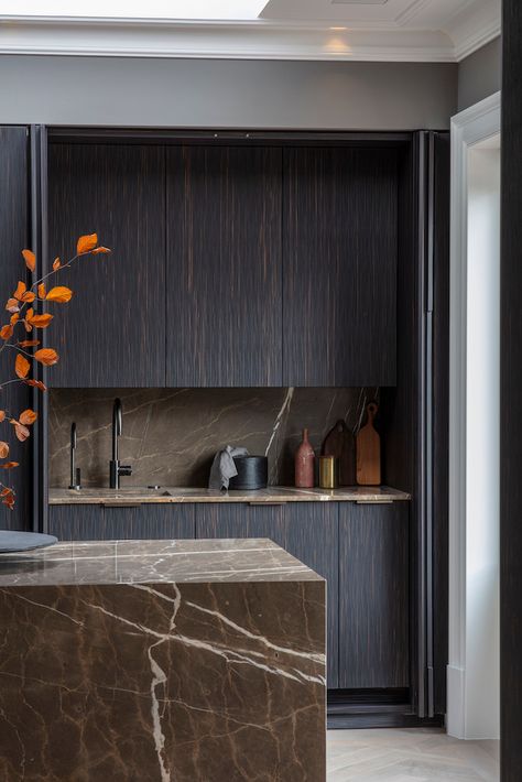 Continuing our #Autumnal theme with this stunning dark hued kitchen from @eggersmanndesign which uses a coffee brown marble for the countertops and backsplash with Maro Ebony composite wood for the cabinetry. #eggersmanndesign #kitchendesign #kitchendecor #luxurykitchen #luxurydecor #kitchenisland #bespokekitchen #kitcheninspo #interiordesign #interiordecor #luxuryhome #luxuryresidence #luxuryresidential #handcrafted #kitchendesign #dreamkitchen #darkkitchen Dark Wood Kitchen, Dark Brown Kitchen, Latest Kitchen Trends, Timber Kitchen, Dark Wood Kitchens, Dark Modern, Brown Marble, Brown Kitchens, Stone Kitchen