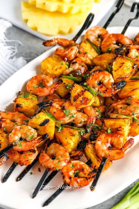 This recipe for juicy, tender shrimp kabobs arrives just in time for barbecue season! Jumbo shrimp are seasoned with a spicy marinade, then threaded on skewers with chunks of juicy fresh pineapple, and cooked on the grill. Try them with chicken, steak, sausage, or an array of vegetables. Bacon-wrapped shrimp with scallops is another tasty variation! #shrimpkabobs #shrimpkabobrecipe #grilledshrimpkabobs #spendwithpennies Grilled Shrimp Kabobs, Shrimp Kabob Recipes, Pineapple Skewers, Wrapped Shrimp, Veggie Kabobs, Shrimp Kabobs, Bacon Wrapped Shrimp, Marinated Shrimp, Homemade Barbecue Sauce