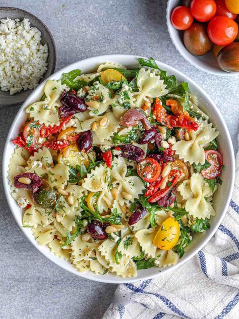 Arugula Pasta Salad - Munchmeals by Janet Arugula Pasta Salad, Pasta Primavera Salad, Salad Arugula, Arugula Pasta, Mediterranean Pasta Salads, Vegan Pasta Salad, Dijon Dressing, Vegan Feta Cheese, Mediterranean Pasta