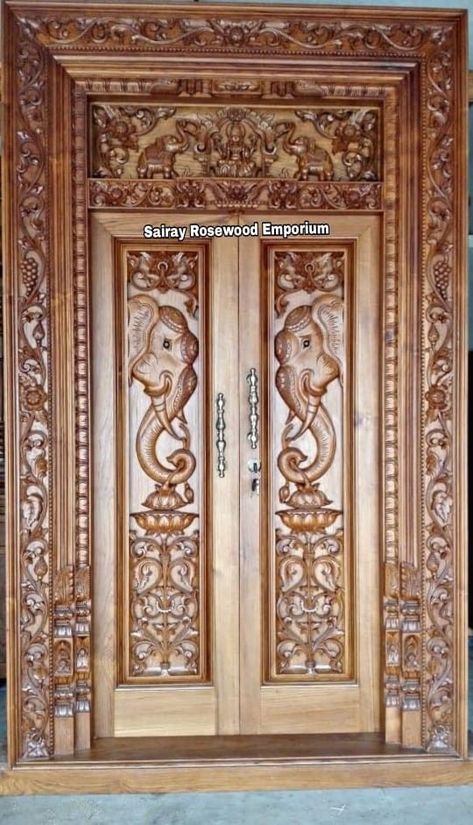 Pooja Room Door Carving Designs, House Main Door Design Woods, Double Door Carving Design Wood, Wooden Double Door Design Entrance Carved Wood, Wood Carving Doors Design, Carved Doors Wooden, Main Door Carving Design Double Door, Take Wood Main Door Design, Pooja Room Door Design Wood Carving