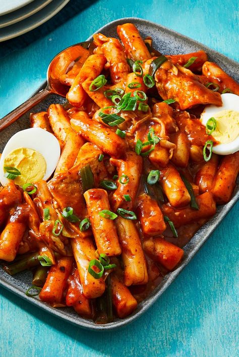 Tteokbokki is a spicy Korean dish made from chewy rice cakes. Our recipe for Tteokbokki serves four and comes together in just 40 minutes. #tteokbokki #koreanrecipes #bhg Teokkboki Recipes Easy, Tteokbokki Aesthetic, Korean Food Tteokbokki, Non Spicy Tteokbokki, How To Make Tteokbokki Rice Cakes, Tteokbokki Not Spicy, Rice Cake Recipes Tteokbokki, Rice Cakes Recipe, Street Food At Home