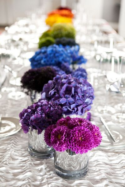 Stunningly simple rainbow flower centerpiece set against a white table. Colourful Weddings, Colorful Table Setting, Vibrant Wedding, Tafel Decor, Boda Mexicana, Lgbt Wedding, Rainbow Wedding, Rainbow Flower, Year 6