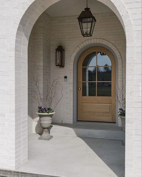 Arched Front Door Entryway, Front Door Single, Exterior Entryway Ideas, Arched Exterior Doors, Modern European Farmhouse, Arch Entryway, Arched Front Door, Low Country Homes, Brick Archway