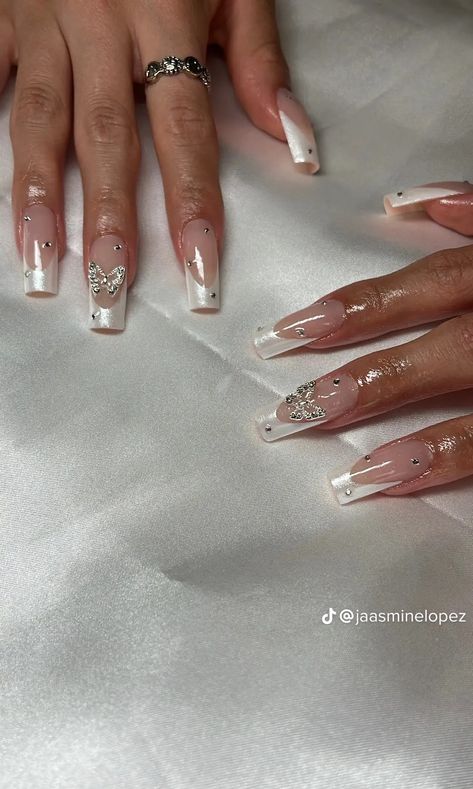 Gel X With Charms, White French With Charms, Pearly White French Tip Nails, Pearly French Tip Nails, Frenchies With Rhinestones, Nail Inspo With Charms, White Nails With Charms, Nails With Pearls On Them, Pearl French Tip Nails