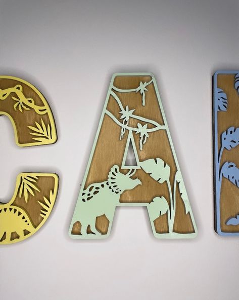 Our dinosaur themed letters can be ordered individually or together to create a personalised wall sign. Available in a multitude of colours. (If you can't see your preferred colour choice please message us) Each letter measures approximately - 15cm tall and is double layered If you require larger letters please message us for a quote. If your not already please follow our instagram page @Studioblakecreative for latest product launches/Promo codes and competitions x x x Green Dinosaur Bedroom, Dino Bedroom Ideas, Dinosaur Bedroom Ideas, Dinosaur Themed Bedroom, Dinosaur Name Sign, Dinosaur Letters, Kid Wall Art, Nursery Dinosaur, Dinosaur Decor Bedroom