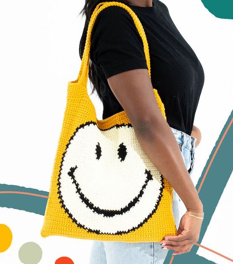 How To Make Feels Like Butta Smiley Face Tote Online | JOANN Crochet Smiley Bag, Smiley Face Crochet, Viking Sewing, Yarn Skein, Crochet Hat Free, Bag Pattern Free, Crochet Hats Free Pattern, Diy Bags, Lion Brand Yarn