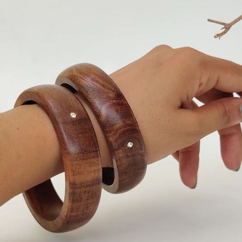 "EcoWood Bangles " . Each wooden bangle is meticulously handcrafted, showcasing the fusion of natural materials and subtle elegance. The base material—rosewood—brings warmth, texture, and an earthy vibe to the design. . zirconia adds a touch of sophistication. . The smooth, polished surface feels comfortable against the skin, making these bangles perfect for everyday wear. . Size - 2.4 & 2.8 available . #customisationavailable For custom order Dm or WhatsApp me at 7304854836. THANK you . . .... Wooden Jewellery, Wooden Bangle, Subtle Elegance, Wooden Jewelry, Xmas Gifts, Natural Materials, Pretty Outfits, Everyday Wear, Bangles