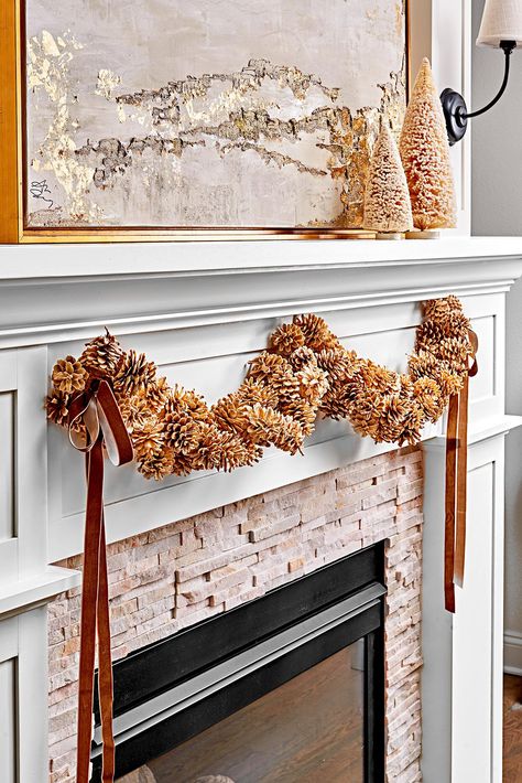 fireplace-pinecone-decoration-d53f0e2f Decorating With Pinecones, Pine Cone Christmas Decorations, Holiday Decorating Ideas, Classic Holiday Decor, Winter Door Decorations, Painted Pinecones, Winter Wreath Diy, Pinecone Garland, Cone Crafts