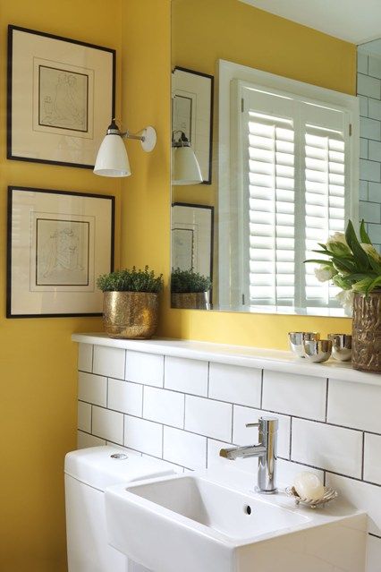 Bright yellow paint works as a perfect foil to white industrial tiles and gold accessories in this London bathroom. Bad Inspiration, Bathroom Paint Colors, Yellow Bathrooms, Bathroom Color, Downstairs Bathroom, Boho Bathroom, Yellow Walls, Small Bathroom Design, Bathroom Layout