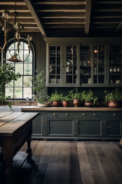 Discover the allure of moody farmhouse kitchen ideas that blend the warmth of traditional rustic design with a hint of contemporary drama. Embrace deep, rich color palettes, weathered wood accents, and vintage-inspired fixtures to infuse your kitchen with an inviting ambiance. Let the interplay of dark hues and natural textures transport you to a space that exudes timeless charm and modern elegance. Gothic Kitchen Ideas, Moody Farmhouse, Moody Kitchen, Gothic Kitchen, Farmhouse Kitchen Ideas, Farmhouse Style Kitchen, Cottage Kitchen, Cozy Space, Counter Top