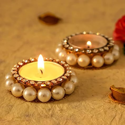 Amazon.com: Desi Favors Set of 2 Pearl tealight Holder for Diwali Gifts/Return Gifts : Home & Kitchen Diwali Candle Holders, Diya Designs, Diya Decoration Ideas, Diwali Diya Decoration, Diwali Candles, Thali Decoration Ideas, Indian Wedding Favors, Diwali Decoration Items, Diy Diwali Decorations