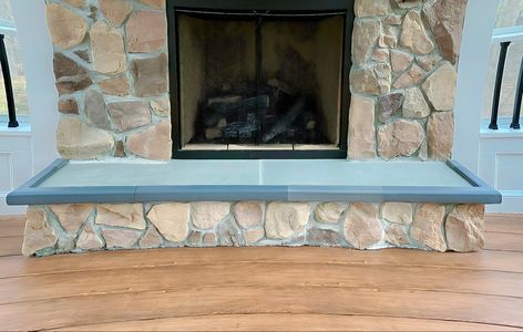 Large stone fireplace with gray hearth padding Fireplace Baby Proofing, Hearth Pad, Gray Furniture, Fireplace Hearth, Large Stone, Corner Protectors, Baby Proofing, Stone Fireplace, Made In The Usa