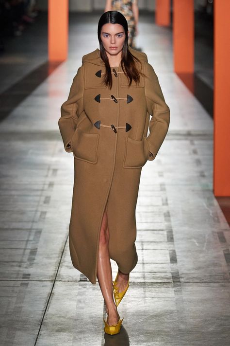 Channel your inner Paddington Bear with the return of the Noughties duffel coat trend. See and shop the best duffle coats for women, here. Prada Fashion Show, Duffel Coat, Vogue France, Prada Fashion, Coat Trends, Milano Fashion Week, Duffle Coat, Miuccia Prada, Raf Simons